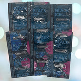 The image showcases several packets of "Caution Wear Black Ice Condoms," known for providing extra sensitivity. They are orderly arranged in a grid pattern against a gently blurred background.